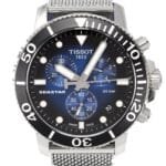 ساعه من tissot تعمل بعدادات بلون اسود & ازرق وسير فضي من المعدن